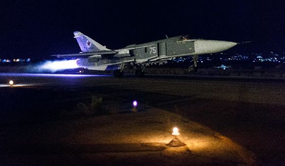 A Russian Su-24 bomber takes off on a night combat mission in Syria. (Russian Defense Ministry Press Service via Associated Press)