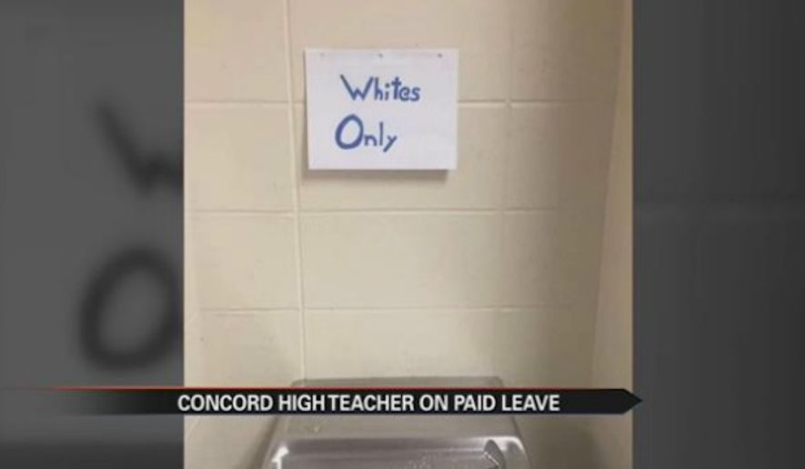 A teacher at Concord High School in Indiana has been placed on administrative leave after students posted &quot;whites only&quot; and &quot;blacks only&quot; signs near school bathrooms and drinking fountains as part of a social studies assignment on segregation. (ABC57)
