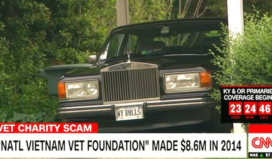 A Rolls Royce belonging to J. Thomas Burch, the CEO of the National Vietnam Veterans Foundation, prepares to speed away from a CNN reporter. (CNN screenshot)