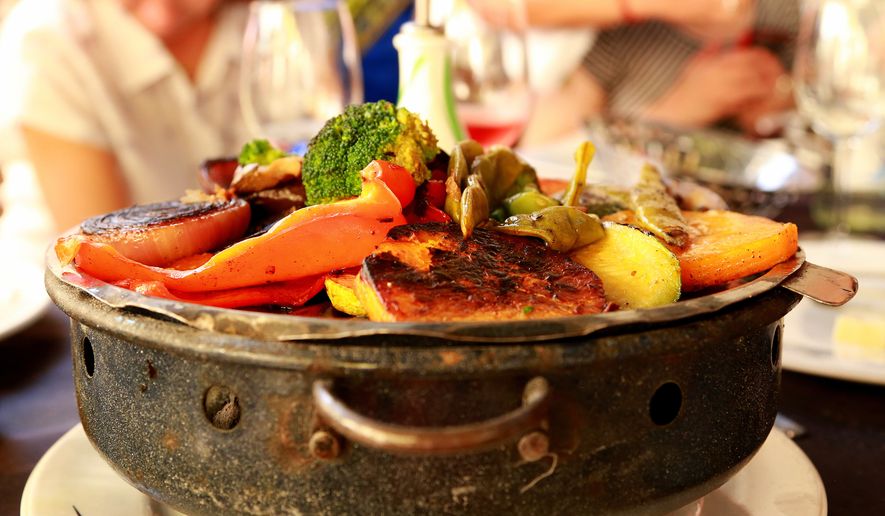 This picture taken March 13, 2016, shows grilled vegetables as served at El Palenque, one of the parillas, or grill restaurants, in Montevideo&#39;s Mercardo del Puerto, a popular place for lunch. Montevideo may not be as well known to travelers as some other Latin American destinations but there is plenty to see and do in this friendly, laid-back city, from beach strolls to late-night dinners.  (Michelle Locke via AP)