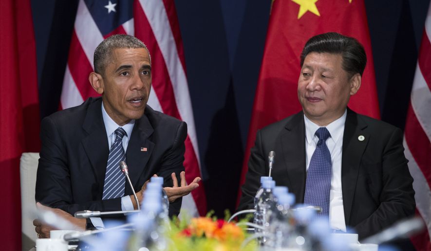 In this file photo taken Nov. 30, 2015, President Barack Obama meets with Chinese President Xi Jinping in Le Bourget, France. A trade deal that is a centerpiece of Obama&#39;s efforts to counter Chinese influence in Asia hangs in the balance as he makes his last visit to Asia as president. (AP Photo/Evan Vucci) ** FILE **