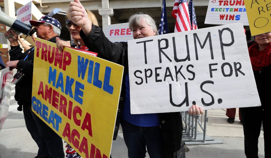 Demonstrators at Los Angeles International Airport showed support for President Trump&#39;s executive order banning travel to the U.S. from seven primarily Muslim nations. (Associated Press)