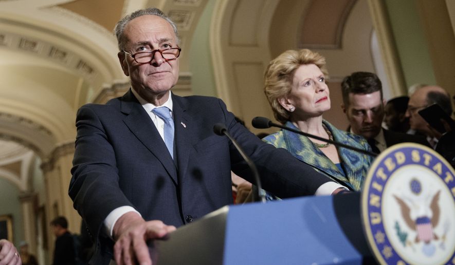 Senate Minority Leader Chuck Schumer, D-N.Y., with Sen. Debbie Stabenow, D-Mich., right, meets with reporters on Capitol Hill before President Donald Trump&#39;s speech to the nation, in Washington, Tuesday, Feb. 28, 2017. (AP Photo/J. Scott Applewhite)