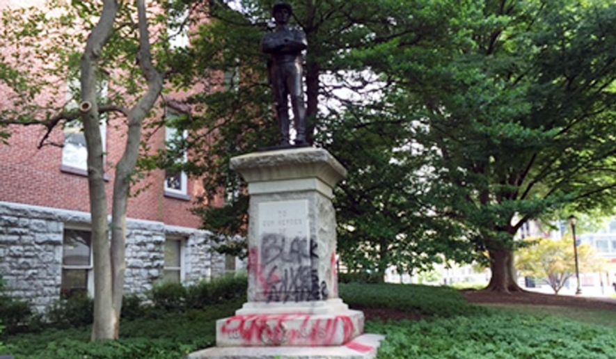 Depicted is a Confederate monument in Rockville, Md., shown here as defaced in a 2015 vandalism incident. The statue, dedicated to Montgomery County residents who fought for the South, will be relocated to the historic White's Ferry in Dickerson, Md. (NBC Washington) [http://media.nbcwashington.com/images/1200*675/confederate+statue.jpg]