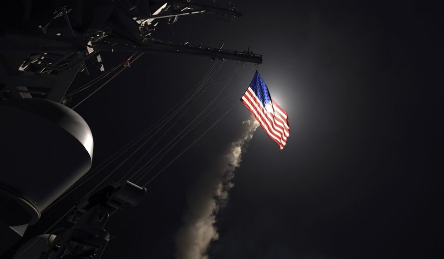 In this image provided by the U.S. Navy, the guided-missile destroyer USS Porter (DDG 78) launches a tomahawk land attack missile in the Mediterranean Sea, Friday, April 7, 2017. The United States blasted a Syrian air base with a barrage of cruise missiles in fiery retaliation for this week&#39;s gruesome chemical weapons attack against civilians. (Mass Communication Specialist 3rd Class Ford Williams/U.S. Navy via AP)
