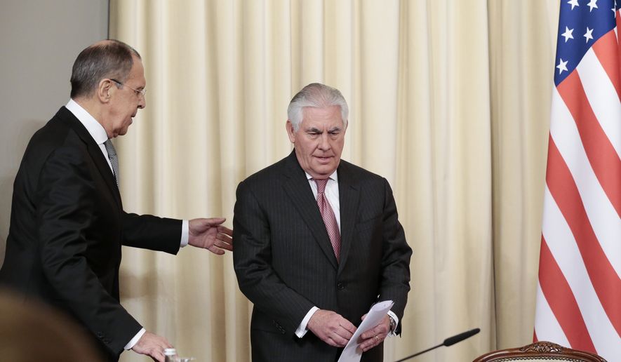 Russian Foreign Minister Sergey Lavrov, left, welcomes US Secretary of State Rex Tillerson to attend a news conference following their talks in Moscow, Russia, Wednesday, April 12, 2017. Amid a fierce dispute over Syria, the United States and Russia agreed Wednesday to work together on an international investigation of a Syrian chemical weapons attack last week. (AP Photo/Ivan Sekretarev)