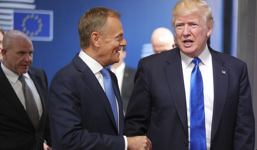 U.S. President Donald Trump is greeted by European Council President Donald Tusk as he arrives at the Europa building in Brussels on Thursday, May 25, 2017. Trump arrived in Belgium Wednesday evening and will attend a NATO summit as well as meet EU and Belgian officials. (AP Photo/Olivier Matthys)