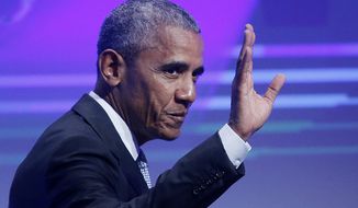Former U.S. President Barack Obama waves before he is awarded the German Media Prize 2016 in Baden-Baden, Germany, Thursday, May 25, 2017. (AP Photo/Michael Probst)