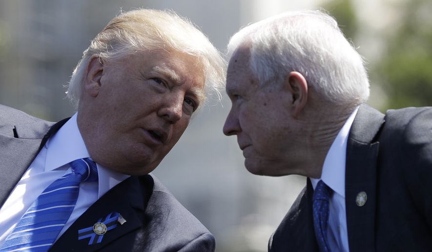 President Donald Trump talks with Attorney General Jeff Sessions, gestures before speaking at the 36th Annual National Peace Officers&#39; memorial service, Monday, May 15. 2017, on Capitol Hill in Washington. (AP Photo/Evan Vucci)