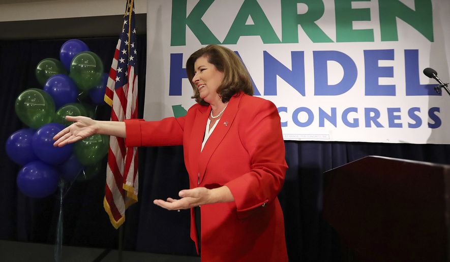 Karen Handel makes an early appearance to thank her supporters after the first returns come in during her election night party in the 6th District race with Jon Ossoff on Tuesday, June 20, 2017, in Atlanta. (Curtis Compton/Atlanta Journal-Constitution via AP)