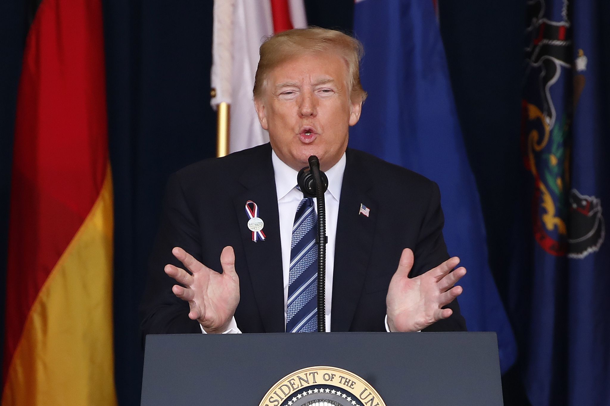 White House officials won't say if Trump will sign spending bills