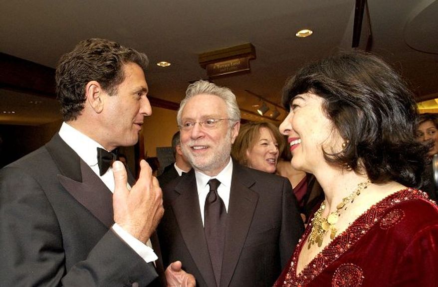 ** FILE ** U.S. News and World Report chief Mort Zuckerman (above left) engages Deputy Secretary of State John Negroponte (center) and his wife, Diana Negroponte at the magazine's pre-dinner reception. Former State Department spokesman Jamie Rubin (below left), CNN's Wolf Blitzer (below center), and Mr. Rubin's wife, international reporter Christiane Amanpour pause for a chat.