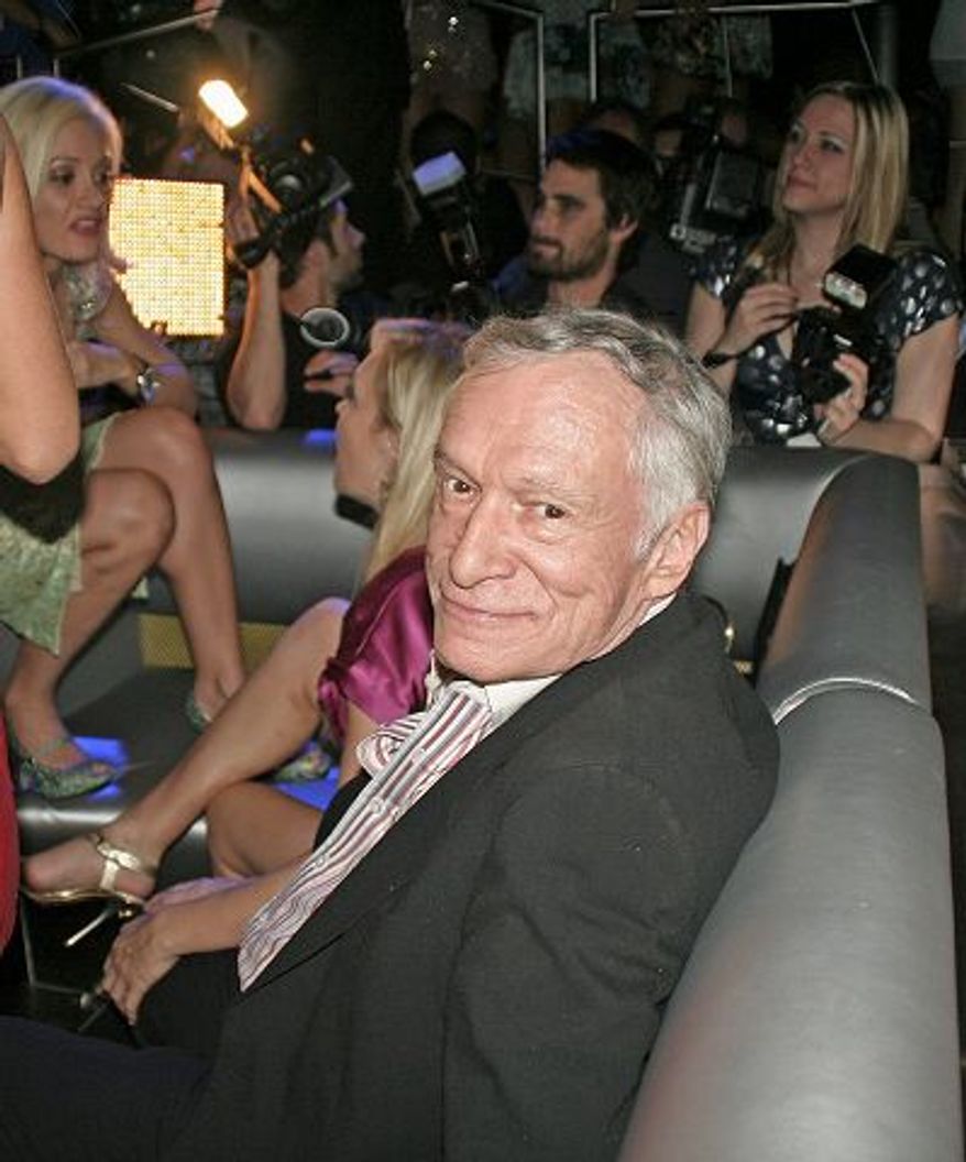 Alison Reynolds/Special to The Washington Times
Camera crews, press, well-wishers and beautiful young ladies celebrate Hugh Hefner's 82nd birthday.