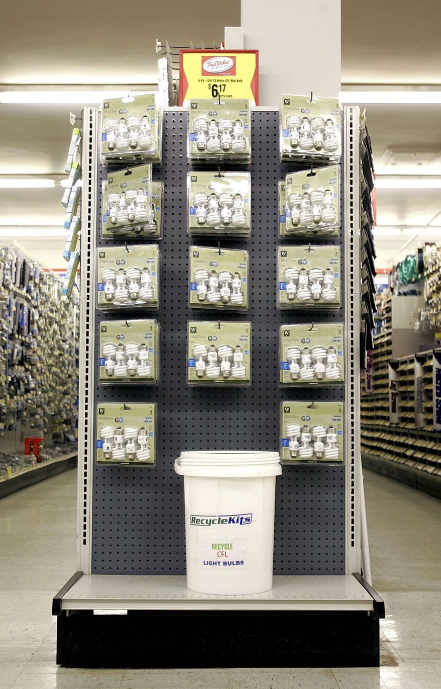 Compact fluorescent light (CFL) bulbs are displayed at Ritters True Value Hardware in Mechanicsburg, Pa. Associated Press
