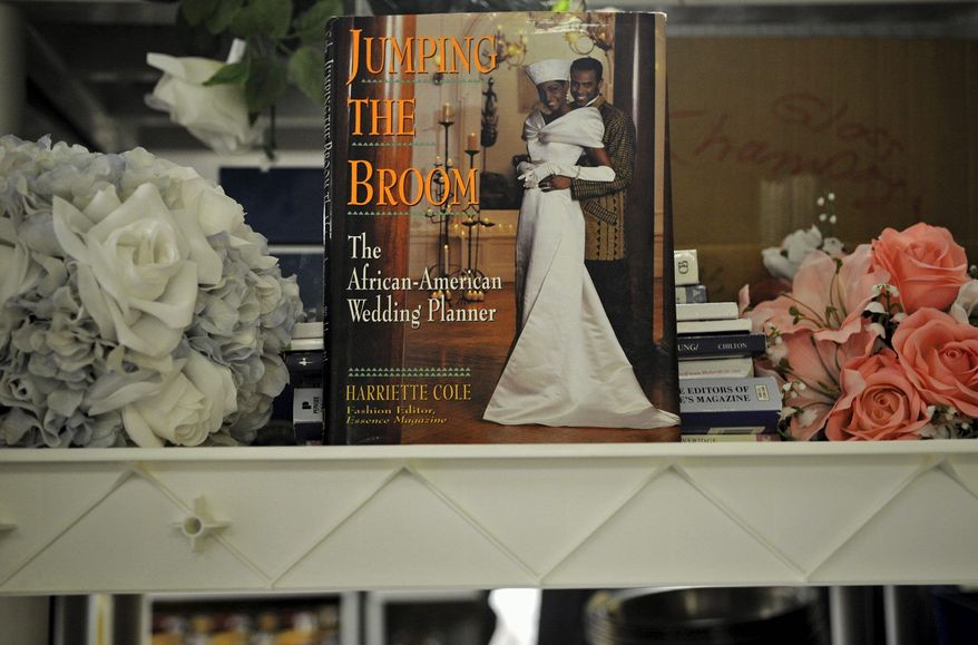 **FILE** Silk flowers and wedding-planning guides are among the items available at St. Anthony's Bridal in Bethesda, a one-stop lending shop for engaged couples. (The Washington Times)