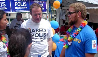 The next three show a man, Jared Polis, talking to three people. Caption: Colorado Democrat Jared Polis, who&#39;s running for Congress, discusses the issues with Pridefest-goers Alex Hernandez, Kelsey Ray and Kyle Pape.

Valerie Richardson/ Special to The Washington Times