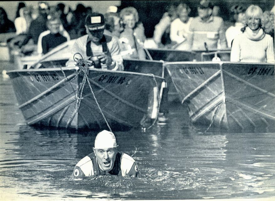 **FILE** Jack LaLanne celebrates his 70th birthday in 1984 by towing 70 boats and 70 persons while swimming 1.5 miles in California's Long Beach Harbor. (Associated Press)