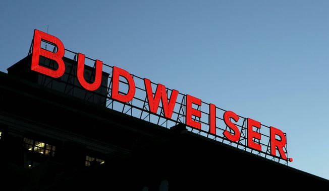 ** FILE ** In this April 21, 2008 file photo, a Budweiser sign is seen atop one of the buildings at the Anheuser-Busch brewery in St. Louis. Belgian brewer InBev announced Monday. July 14, 2008, it will buy Anheuser-Busch for $52 billion. (AP Photo/Jeff Roberson, file)
