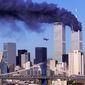 Hijacked United Airlines Flight 175, which departed from Boston en route for Los Angeles, is shown in a flight path for the South Tower of the World Trade Towers Sept, 11, 2001. The North Tower burns after American Airlines Flight 11 crashed into the tower at 8:45 a.m. 
