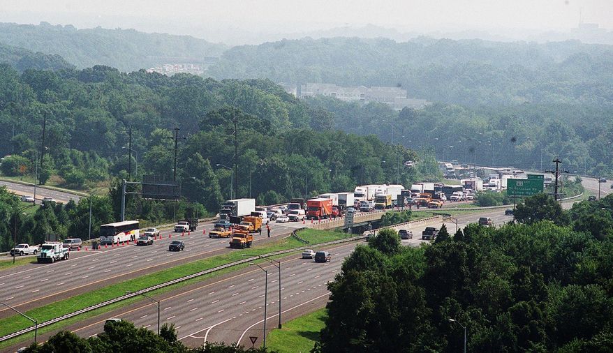 Southbound traffic on the inner loop of the Capitol Beltway is diverted at St. Barnabas Road in Oxon Hill, Md., after a big-rig accident closed the interstate on Tuesday, Aug. 7, 2001. (The Washington Times)