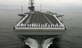 ** FILE ** The aircraft carrier USS Ronald Reagan (Associated Press)
