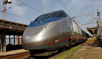 An Amtrak Acela train, with its distinctive bullet nose, pulls into the Wilmington, Del., station after making a fast run from Washington, D.C. (Bloomberg News)