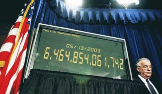 Sen. Paul Sarbanes (D-MD) stands next to the national debt clock used as a prop during a press conference at the Capitol in Washington D.C., USA, Tuesday afternoon May 13, 2003. ( Rod A. Lamkey Jr. / The Washington Times )