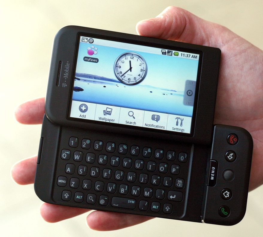 ** FILE ** This Sept. 23, 2008, file photo shows the T-Mobile G1 Android-powered phone, the first cell phone with the operating system designed by Google Inc., during its debut in New York. It costs $179 with a two-year contract. (Associated Press)
