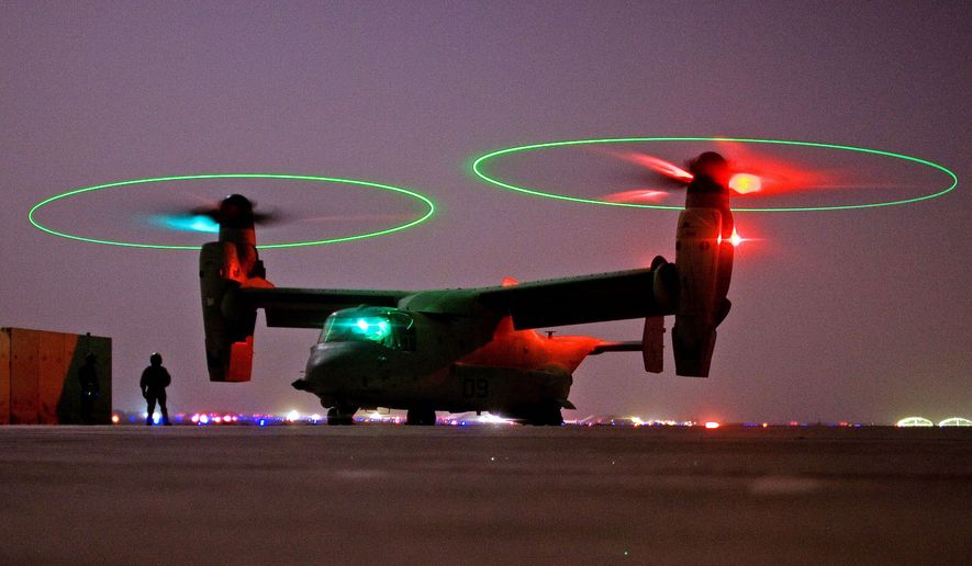 A V-22 Osprey tilt-rotor aircraft taxies after a mission at Asad Air Base in western Iraq. (Associated Press) ** FILE **