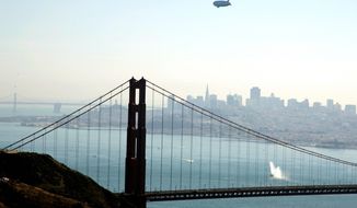 The German-built zeppelin flies over the Golden Gate Bridge, arriving in San Francisco on Oct. 25 to begin aerial tours of the Bay Area. The airship is the first of its kind to fly in the United States in more than 70 years. (Associated Press)