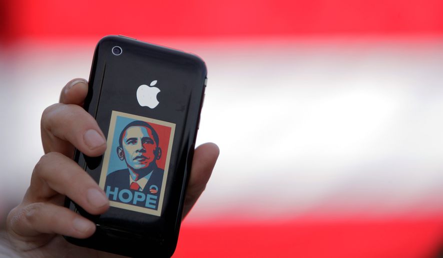 A supporter displays an iPhone during a rally for Sen. Barack Obama in Raleigh, N.C., on Oct. 29, 2008. Sen. Joseph R. Biden Jr.'s very selection as running mate was officially announced to the world through a telephone text message. (Associated Press) **FILE**