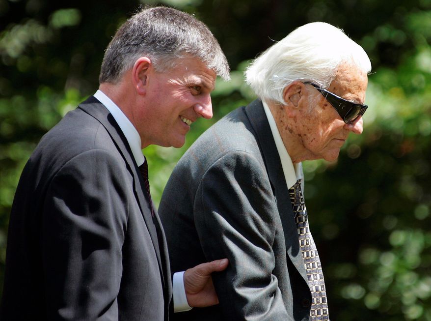 The Rev. Franklin Graham, seen with the Rev. Billy Graham, says his 90-year-old father would "certainly like to meet (President-elect Barack Obama) and pray with him." (Associated Press)