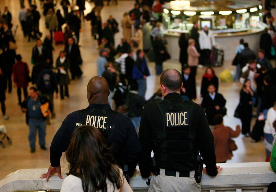 GETTY IMAGES
Police keep watch in Grand Central Terminal on Wednesday in New York. The FBI and Homeland Security Department downplayed the seriousness of a terrorist threat to transit systems.