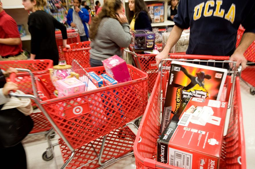 ** FILE ** Aisles near the electronics section (left) were gridlocked as shoppers hustled to find deals at a West Hollywood, Calif., Target store. (Associated Press)