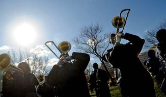 Members of the Ballou Senior High School marching band perform during the 21st Annual Fannie Mae Help the Homeless Walkathon on the Mall. (Rod Lamkey Jr./The Washington Times) ** FILE **