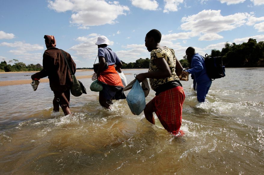 An estimated 1,200 undocumented migrants daily cross the Limpopo River, South Africa&#39;s equivalent of the Rio Grande separating the U.S. and Mexico. Most are from Zimbabwe, where shortages of food and fuel and an unemployment rate of more than 80% have sparked a steady exodus to the more stable and more prosperous South Africa. (Getty Images/File)