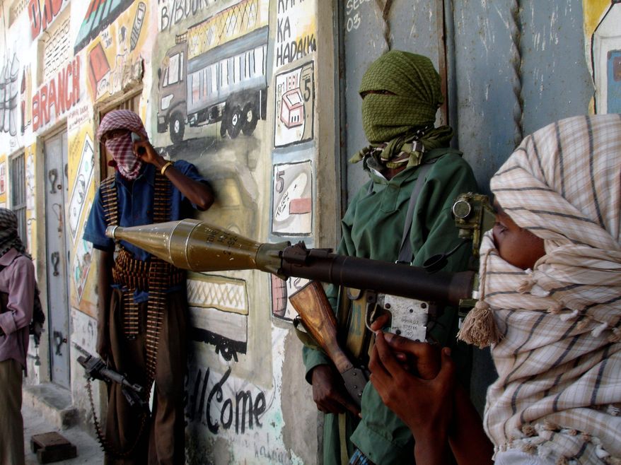 Al-Shabaab insurgents gather with arms in Mogadishu. (Associated Press) **FILE**