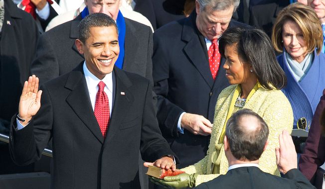 **FILE** Barack Obama is sworn in as the 44th president of the United States of America by Chief Justice of the United States John G. Roberts Jr. at the U.S. Capitol in Washington on Jan. 20, 2009. (J.M. Eddins Jr./The Washington Times)