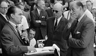 ASSOCIATED PRESS
Gov. George Wallace carries out his promise to stand in the doorway to prevent integration at the University of Alabama at Tuscaloosa, Ala., on June 11, 1963. At right, Nicholas Katzenbach, deputy attorney general of the United States, listens intently to Mr. Wallace. At Mr. Katzenbach&#39;s right is U.S. Marshal Peyton Norville. 