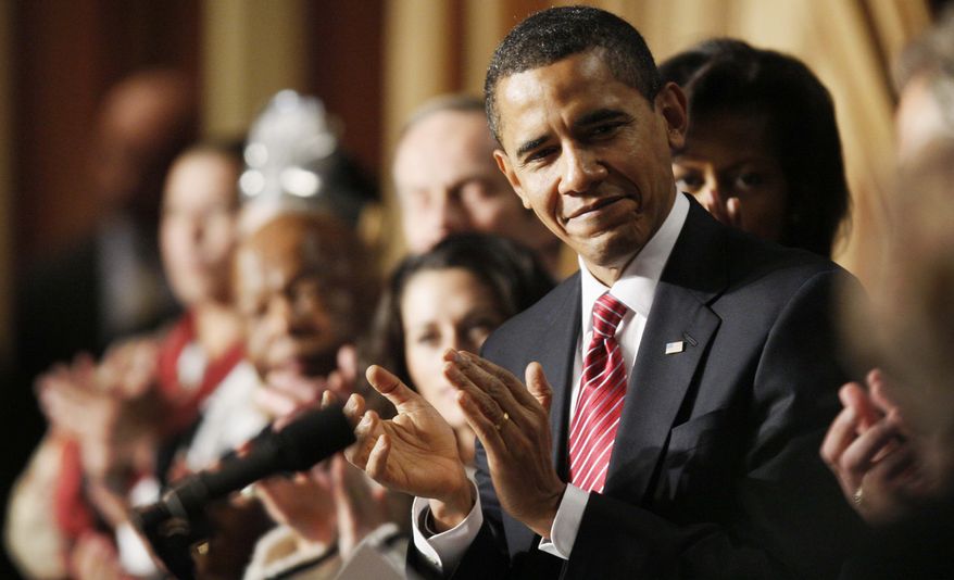 President Barack Obama applauds as he attends the National Prayer Breakfast in Washington, Thursday, Feb. 5, 2009.