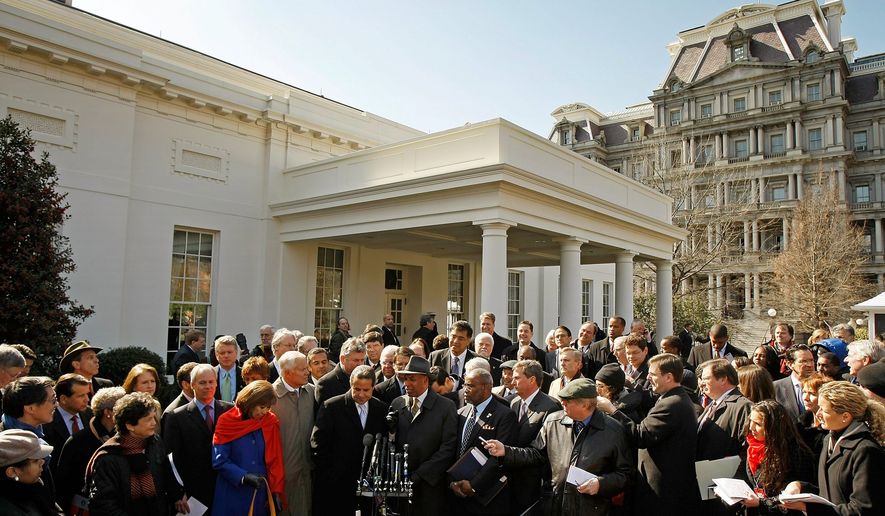 GETTY IMAGES
Mayors from throughout the United States, including President of the U.S. Conference of Mayors Manuel Diaz from Miami (center), gather outside the White House after meeting with President Obama on Friday.