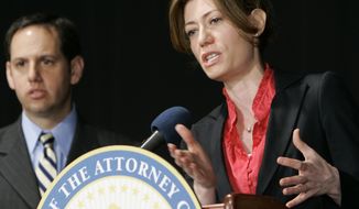 New Jersey Attorney General Anne Milgram speaks during a news conference in East Rutherford, N.J., to discuss ticket sales for entertainment events by Ticketmaster. Milgram announced a settlement with Ticketmaster that changes the way the company sells tickets nationwide over the Internet. David Szuchman, left, director of the state Division of Consumer Affairs, looks on. (Associated Press) **FILE**