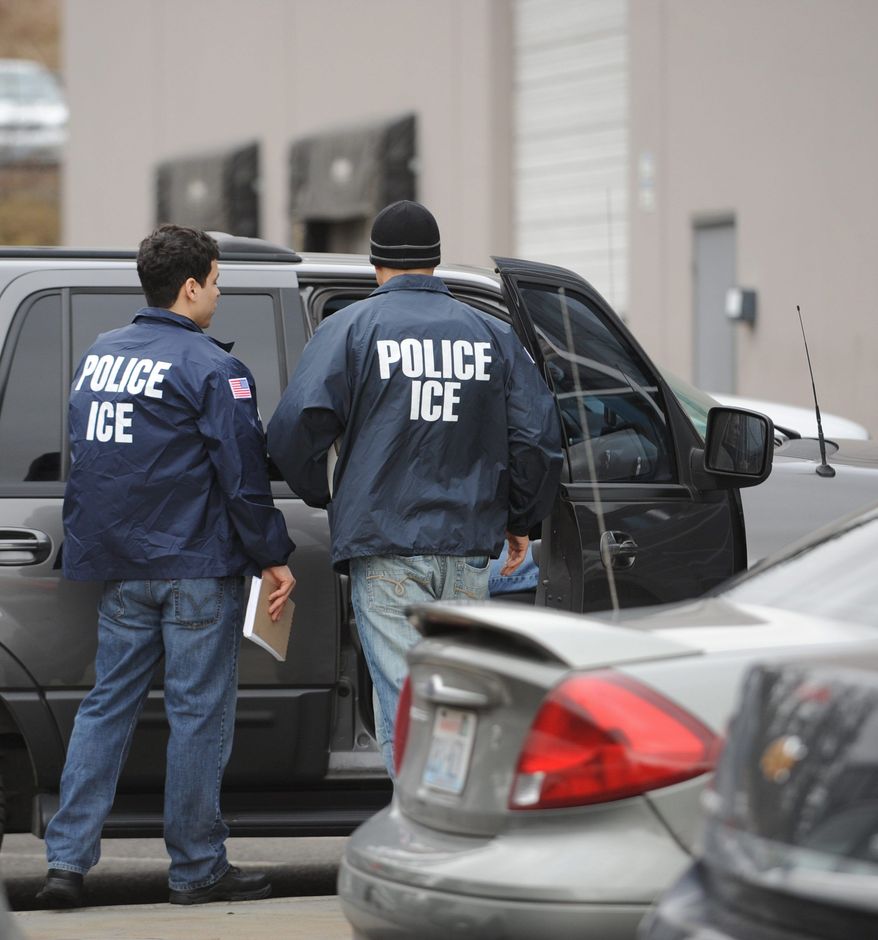 **FILE** U.S. Immigration and Customs Enforcement agents (Associated Press)