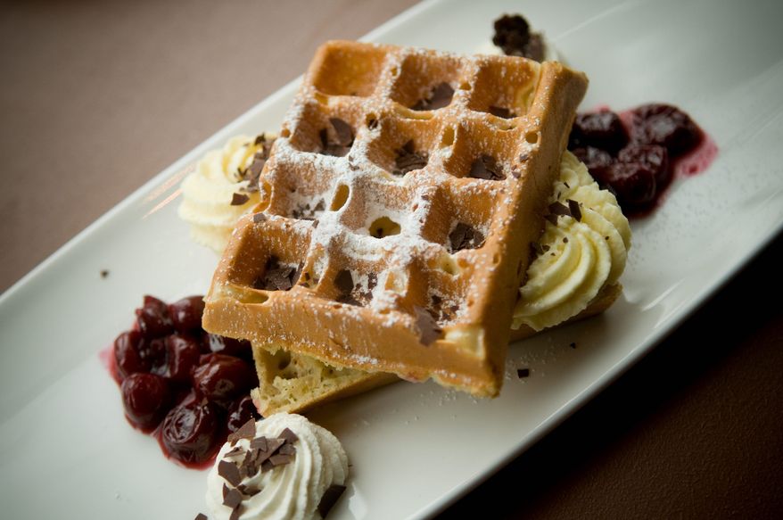 Cherry compote and cream-cheese mousse enhance Brabo's Belgian waffle. Belgian beer is on tap along with other favorites in the bar area.