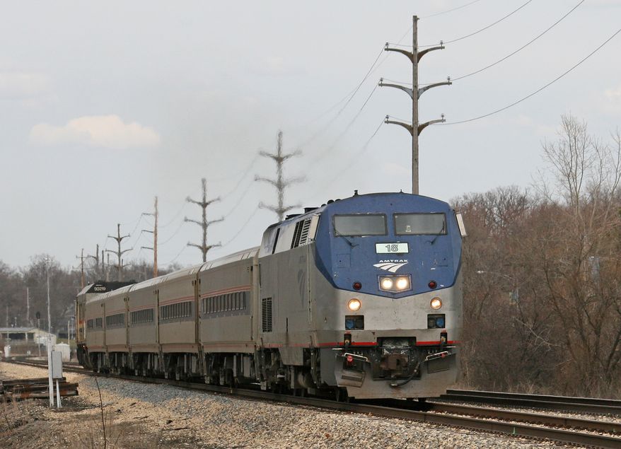 ** FILE ** This April 2, 2009, photo shows an Amtrak passenger train heading west past Western Michigan University in Kalamazoo, Mich. Amtrak and Maryland transportation officials are meeting with riders following a rash of problems with MARC train service. (AP Photo/The Gazette, Scott Harmsen)