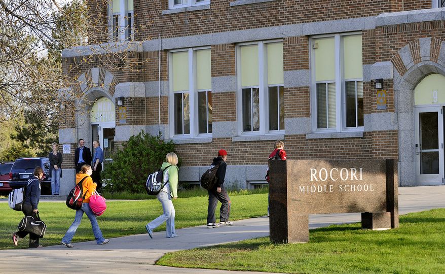 Students head back to school Tuesday morning, May 5, 2009, at Rocori Middle School in Cold Spring, Minn., after the school closed last week due to a case of the swine flu. It was the state's only confirmed swine flu case so far. Orono High School will remain closed for another day, as will Emerson Spanish Immersion School in Minneapolis, where suspected cases have been reported. State health officials are backing away from earlier recommendations to shut down schools where suspected cases have been reported. (AP Photo/The St. Cloud Times, Kimm Anderson)