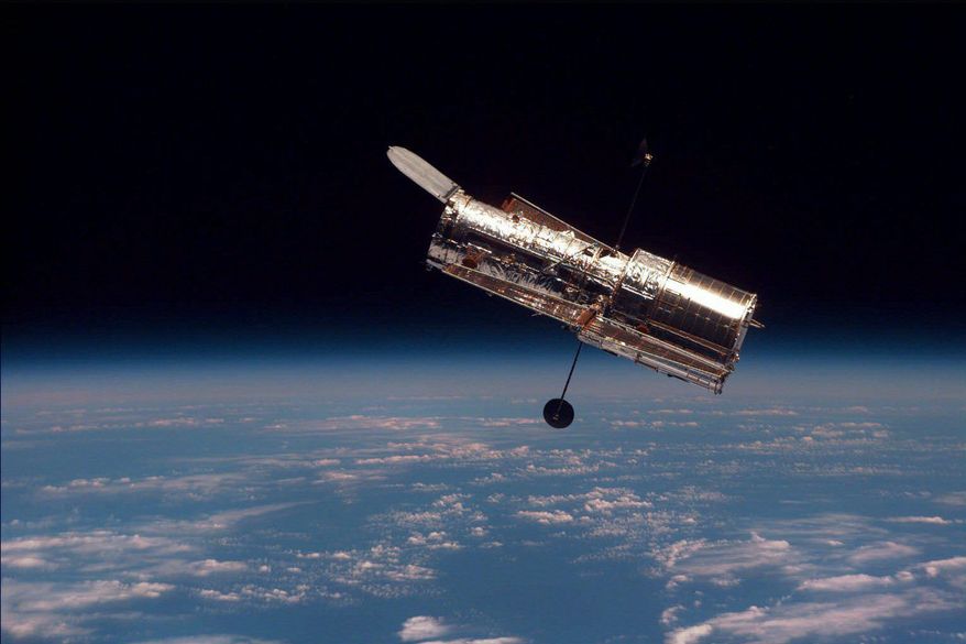 ASSOCIATED PRESS
NASA scientists anticipate ideal weather conditions for the planned shuttle launch Monday to make much-needed repairs on the 19-year-old Hubble Space Telescope, seen here in February 1997.