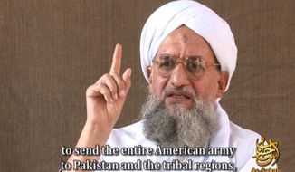 ** FILE ** This video frame grab image provided by IntelCenter, a private terrorism analysis company, and taken from a video released on Friday Nov. 28, 2008, by the media arm of al QaEda, As-Sahab, shows Ayman al Zawahiri speaking in a video entitled &quot;al-Azhar,&quot; or &quot;The Lion&#39;s Den.&quot; Al Qaeda&#39;s No. 2 leader called on Americans to embrace Islam to overcome the financial meltdown, which he said was a consequence of the Sept. 11 attacks and militant strikes in Iraq and Afghanistan. (AP Photo/IntelCenter)