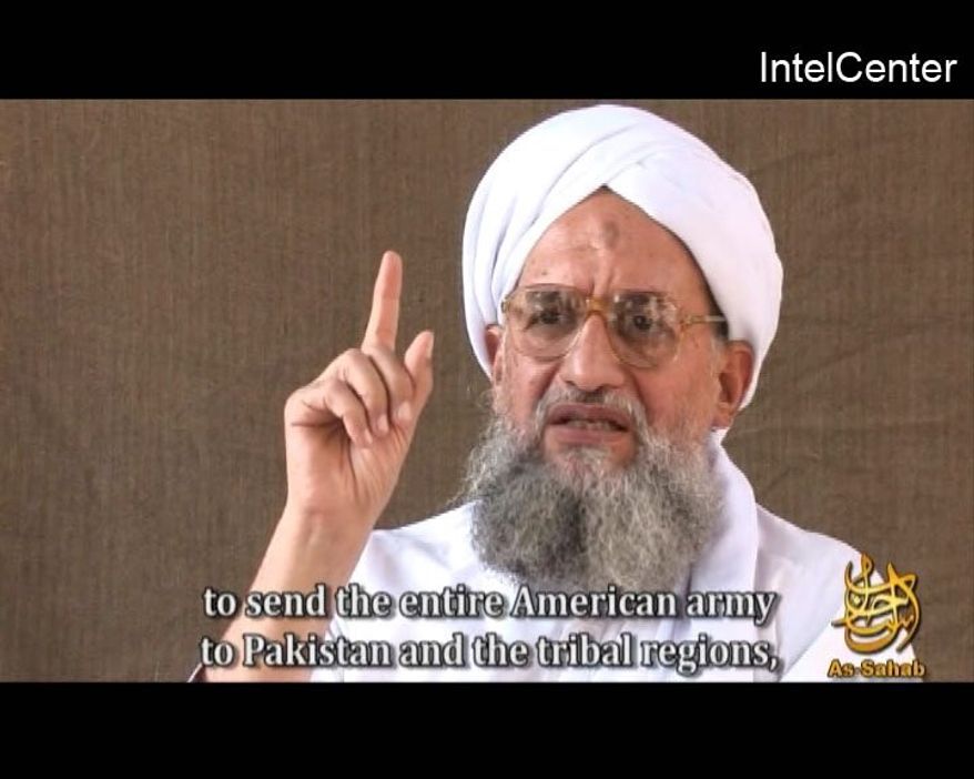** FILE ** This video frame grab image provided by IntelCenter, a private terrorism analysis company, and taken from a video released on Friday Nov. 28, 2008, by the media arm of al QaEda, As-Sahab, shows Ayman al Zawahiri speaking in a video entitled &quot;al-Azhar,&quot; or &quot;The Lion&#39;s Den.&quot; Al Qaeda&#39;s No. 2 leader called on Americans to embrace Islam to overcome the financial meltdown, which he said was a consequence of the Sept. 11 attacks and militant strikes in Iraq and Afghanistan. (AP Photo/IntelCenter)
