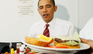 ** FILE ** President Obama is served his cheeseburger (foreground) as he and Vice President Joseph R. Biden (not pictured) eat lunch at Ray&#39;s Hell Burger in Arlington, Va., on Tuesday, May 5, 2009. (AP Photo/Charles Dharapak)